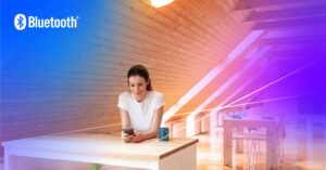 Serene modern workspace with a woman engaging her smartphone amidst a warm, minimalist design.